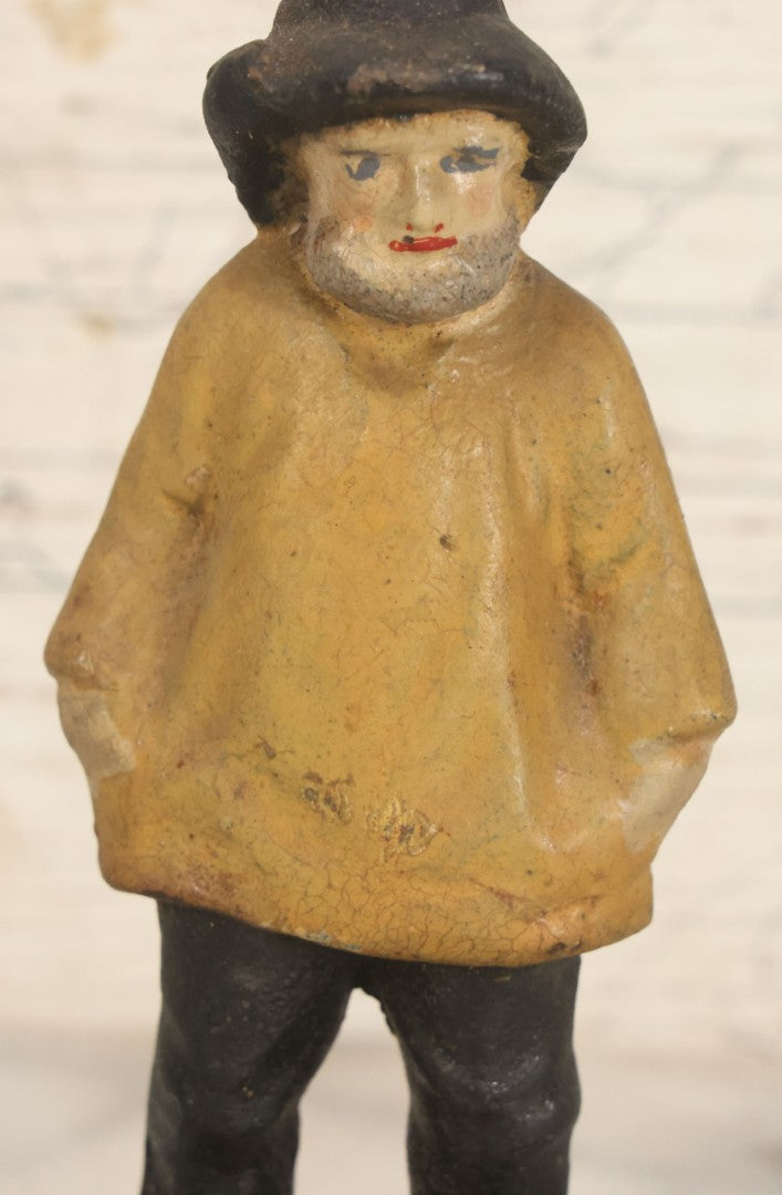 Lot 055 - Vintage Cast Iron Sailor In Yellow Rain Slicker Jacket Door Stop, Hand Painted, Solid