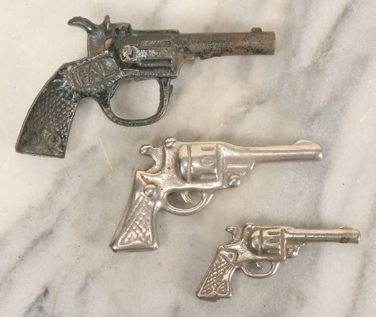 Lot 060 - Grouping Of Three Vintage Die Cast Metal Miniature Toy Guns, Pistols, Including Pal, Others