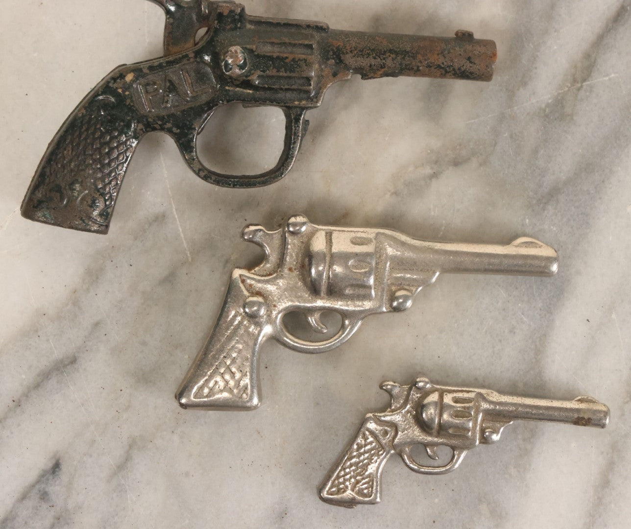 Lot 060 - Grouping Of Three Vintage Die Cast Metal Miniature Toy Guns, Pistols, Including Pal, Others