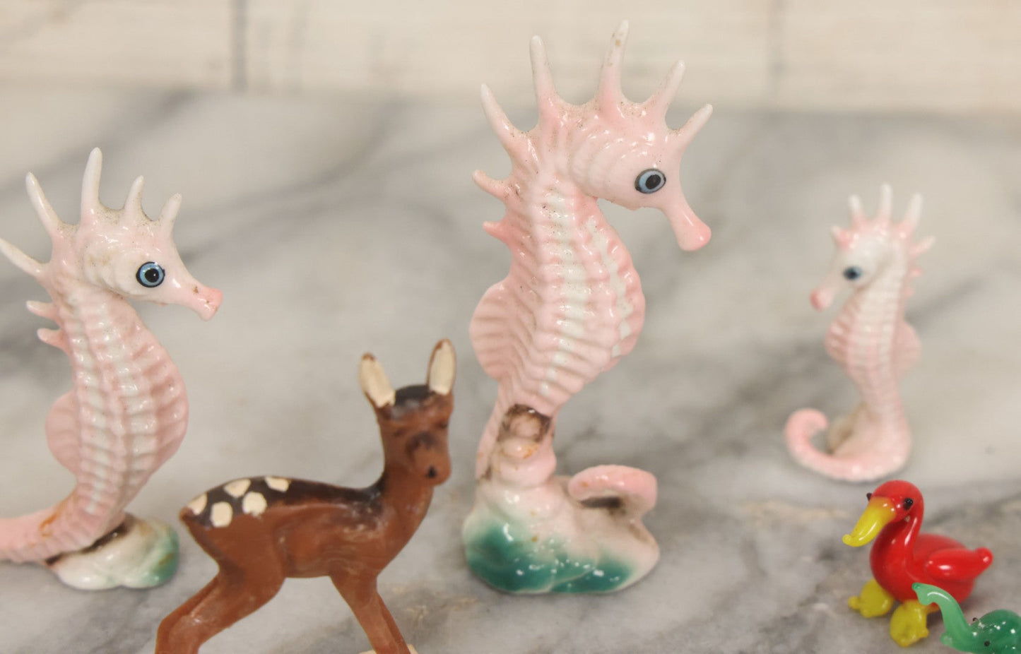 Lot 072 - Miscellaneous Box Lot Grouping Of Glass And Porcelain Animals Including Seahorses, Small Glass Creatures, Plastic Deer, And More, As Found In The Box It Was Found In, Not All Pictured
