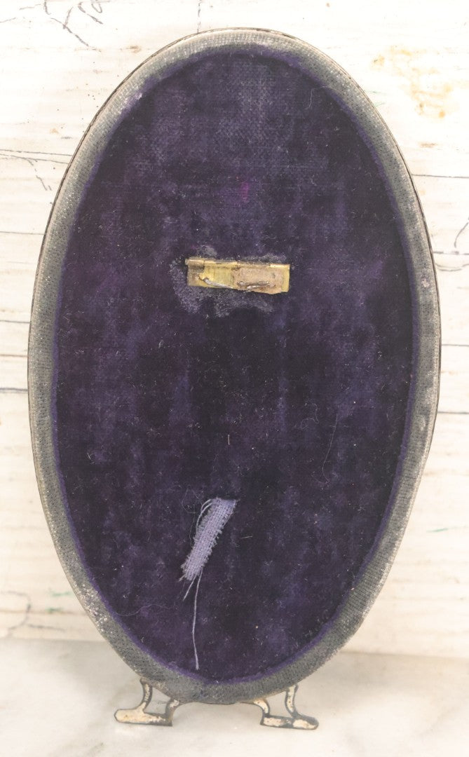 Lot 074 - Antique Oval Shaped Sterling Silver Frame With A Photograph Of An Elderly Woman, Note Missing Kickstand On Back, Marked Sterling, 3" x 5-3/8"