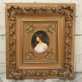 Lot 001 - Fine Antique Hand Painted Porcelain Tile Of Semi-Nude Woman In Ornate Gesso Frame, Marked "Erblüht" ("Blossom") On Verso, After Angelo Asti, Artist Signed Wagner, With Hallmark, 14" x 15-1/2"