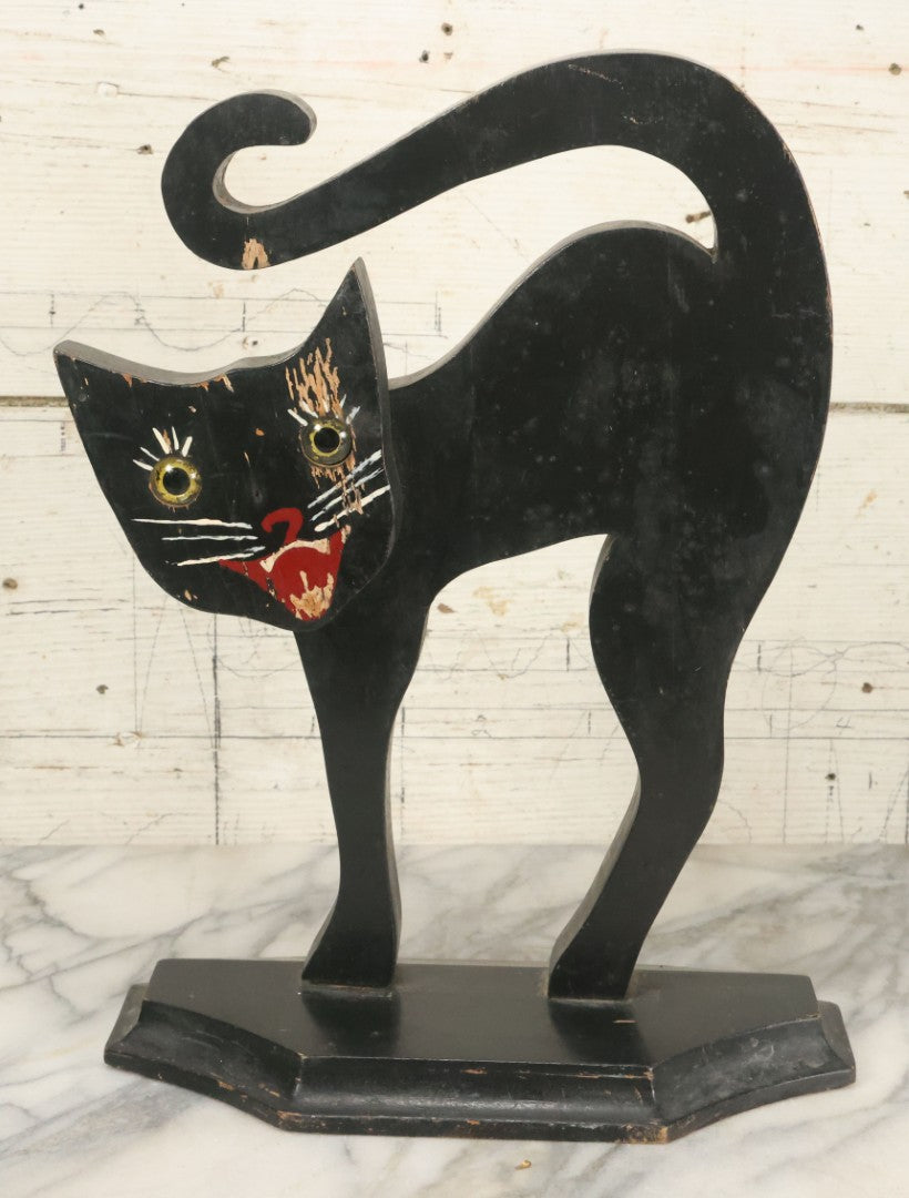 Lot 003 - Antique Folk Art Wood Cut Halloween Black Cat With Grinning Face, Yellow Glass Eyes, On Geometric Base, Note Minor Paint Loss