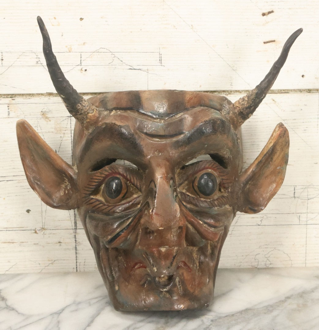Lot 006 - Vintage Folk Art Devil Mask With Real Animal Horns And Whistling Mouth, Hand Carved Wood, Hand Painted, With Wire Hanger