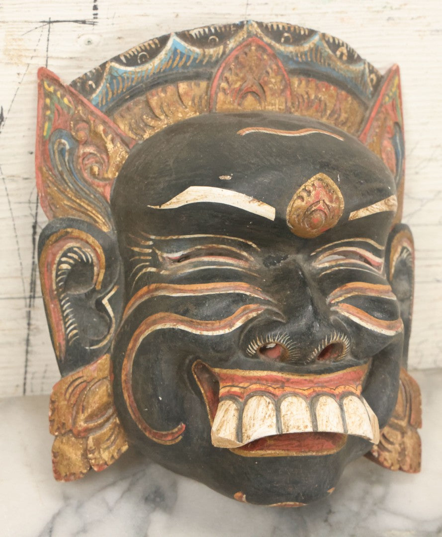 Lot 008 - Vintage Grinning Eastern Mask With Large White Teeth, Hand Carved Wood, Hand Painted, With Wire Hanger, Note Chips To Teeth