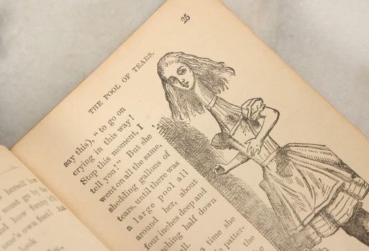 Lot 140 - "Alice's Adventures In Wonderland" Antique Book By Lewis Carroll With Burnt Red Art Nouveau Cover Design And Illustrations Throughout, Note Binding Wear, Circa Late 19th Century