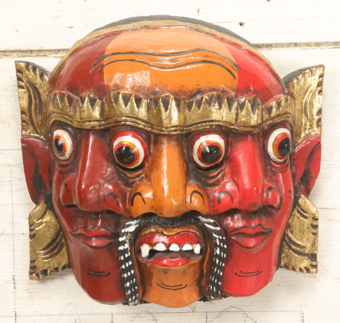 Lot 010 - Vintage Eastern Triple Face God Mask With Red And Orange Faces, Gold Accent Paint, Hand Carved Wood, Hand Painted, With Wire Hanger