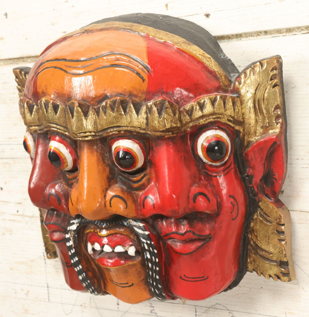 Lot 010 - Vintage Eastern Triple Face God Mask With Red And Orange Faces, Gold Accent Paint, Hand Carved Wood, Hand Painted, With Wire Hanger
