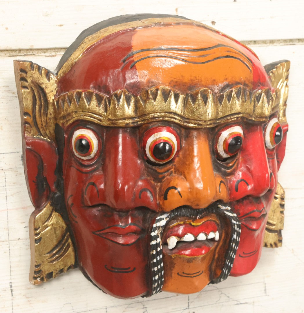 Lot 010 - Vintage Eastern Triple Face God Mask With Red And Orange Faces, Gold Accent Paint, Hand Carved Wood, Hand Painted, With Wire Hanger