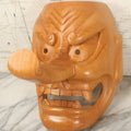Lot 011 - Contemporary Japanese Hannya Mask With Comically Large Nose, Hand Carved Wood, Unpainted, With Rope Hanger