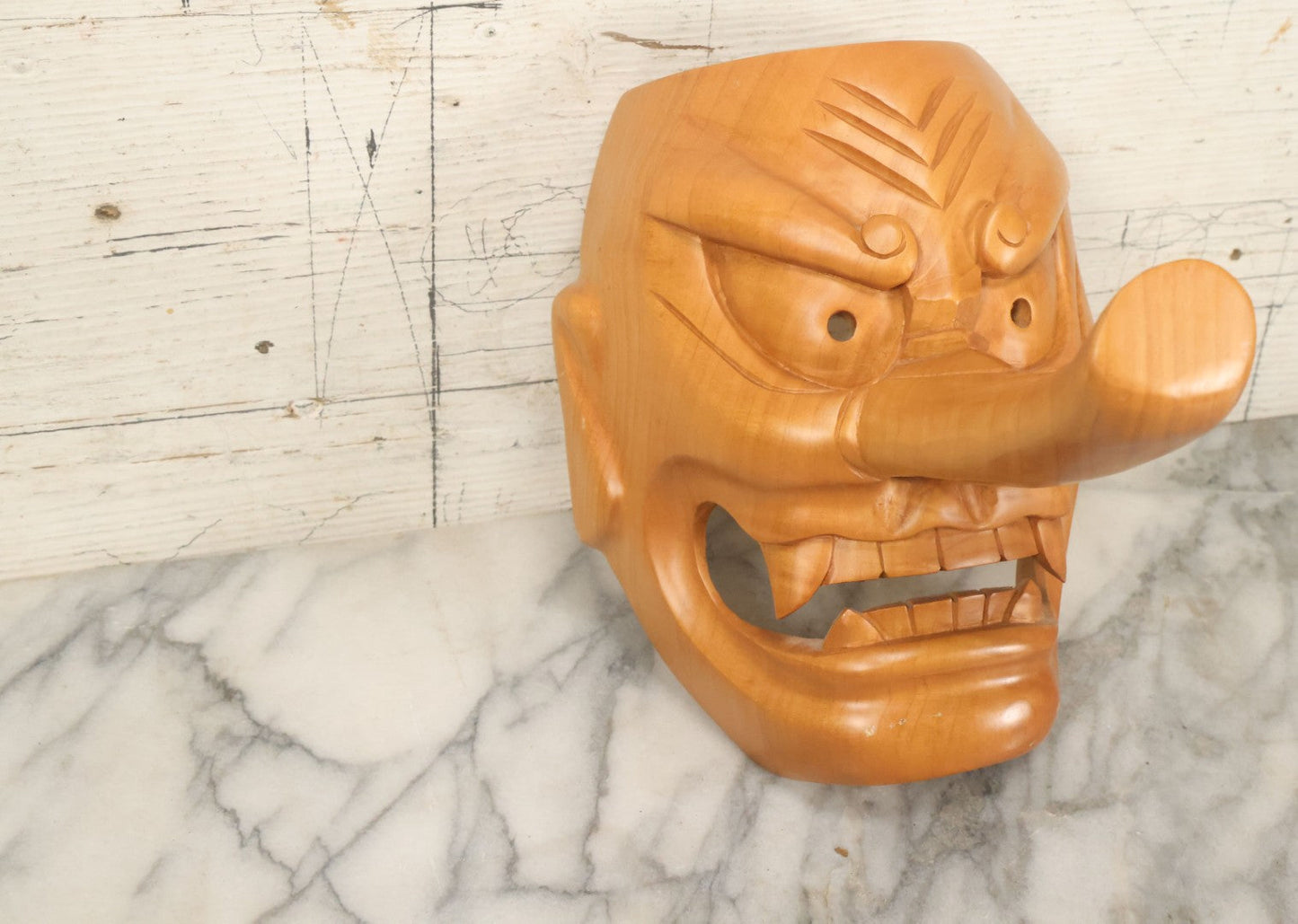 Lot 011 - Contemporary Japanese Hannya Mask With Comically Large Nose, Hand Carved Wood, Unpainted, With Rope Hanger