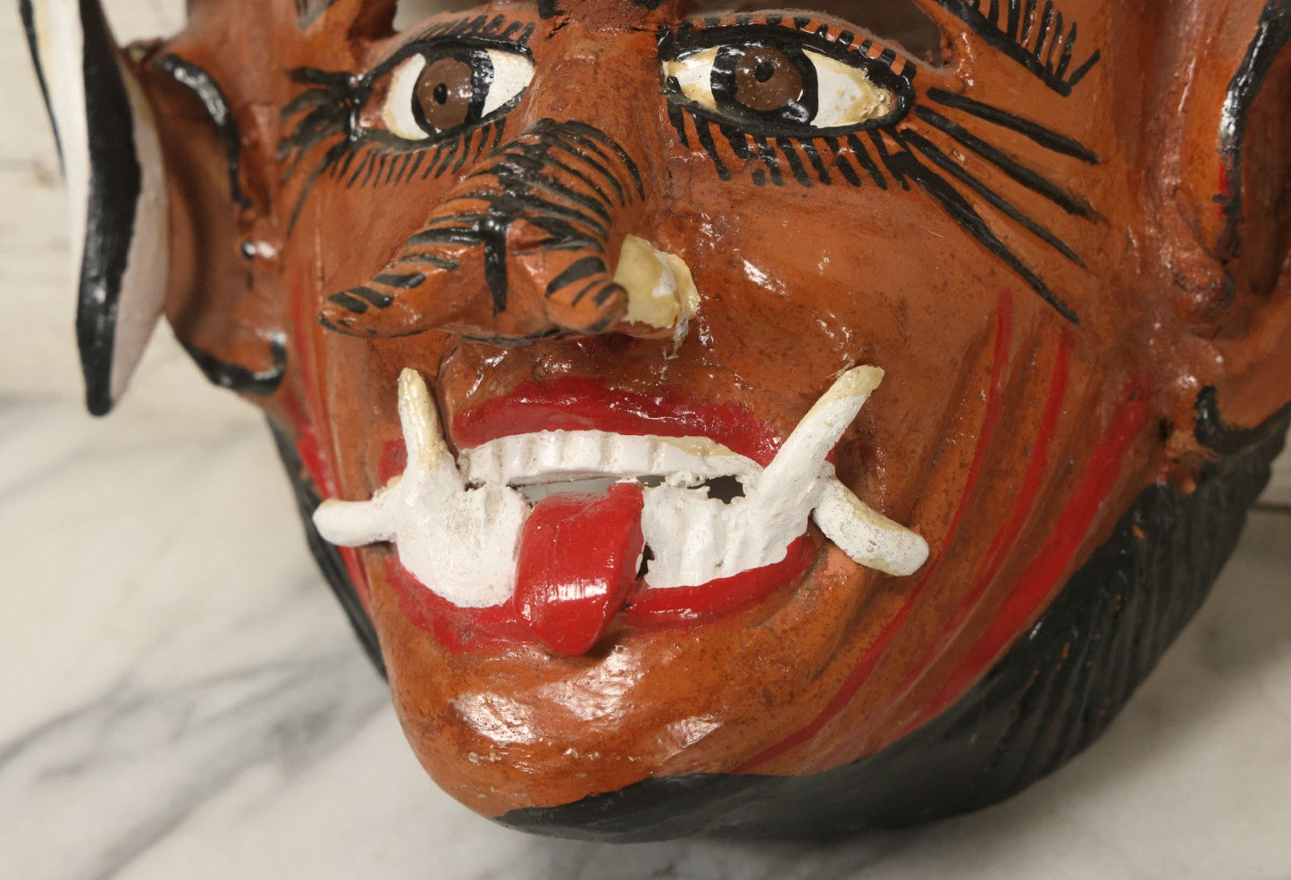 Lot 013 - Vintage Clay Devil Demon Mask With Curly Black And White Horns, Fangs, And Forked Nose, Hand Sculpted, Hand Painted, With Rope Hanger