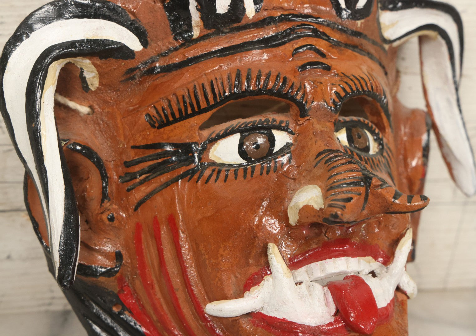 Lot 013 - Vintage Clay Devil Demon Mask With Curly Black And White Horns, Fangs, And Forked Nose, Hand Sculpted, Hand Painted, With Rope Hanger