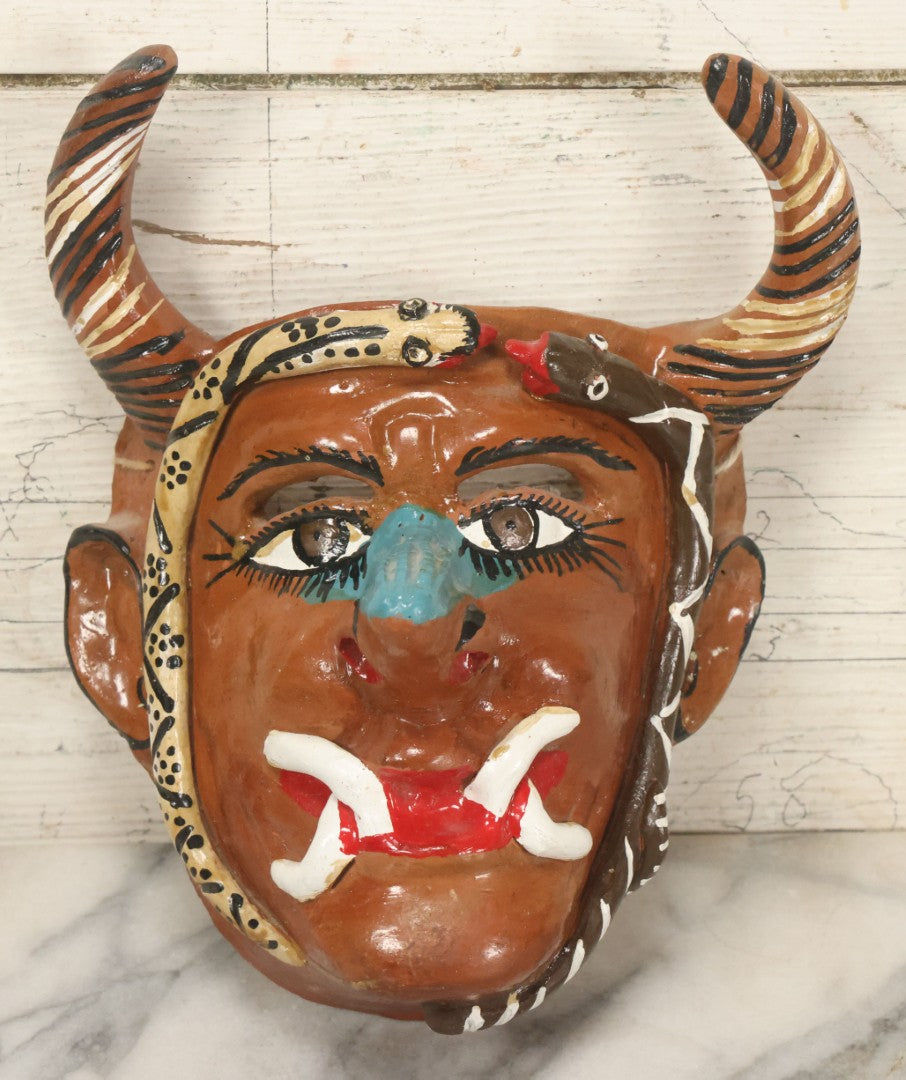 Lot 014 - Vintage Clay Devil Demon Mask With Striped Black And Gold Horns, Snakes Surrounding Face, Fangs, And Blue Nose, Hand Sculpted, Hand Painted, With Rope Hanger