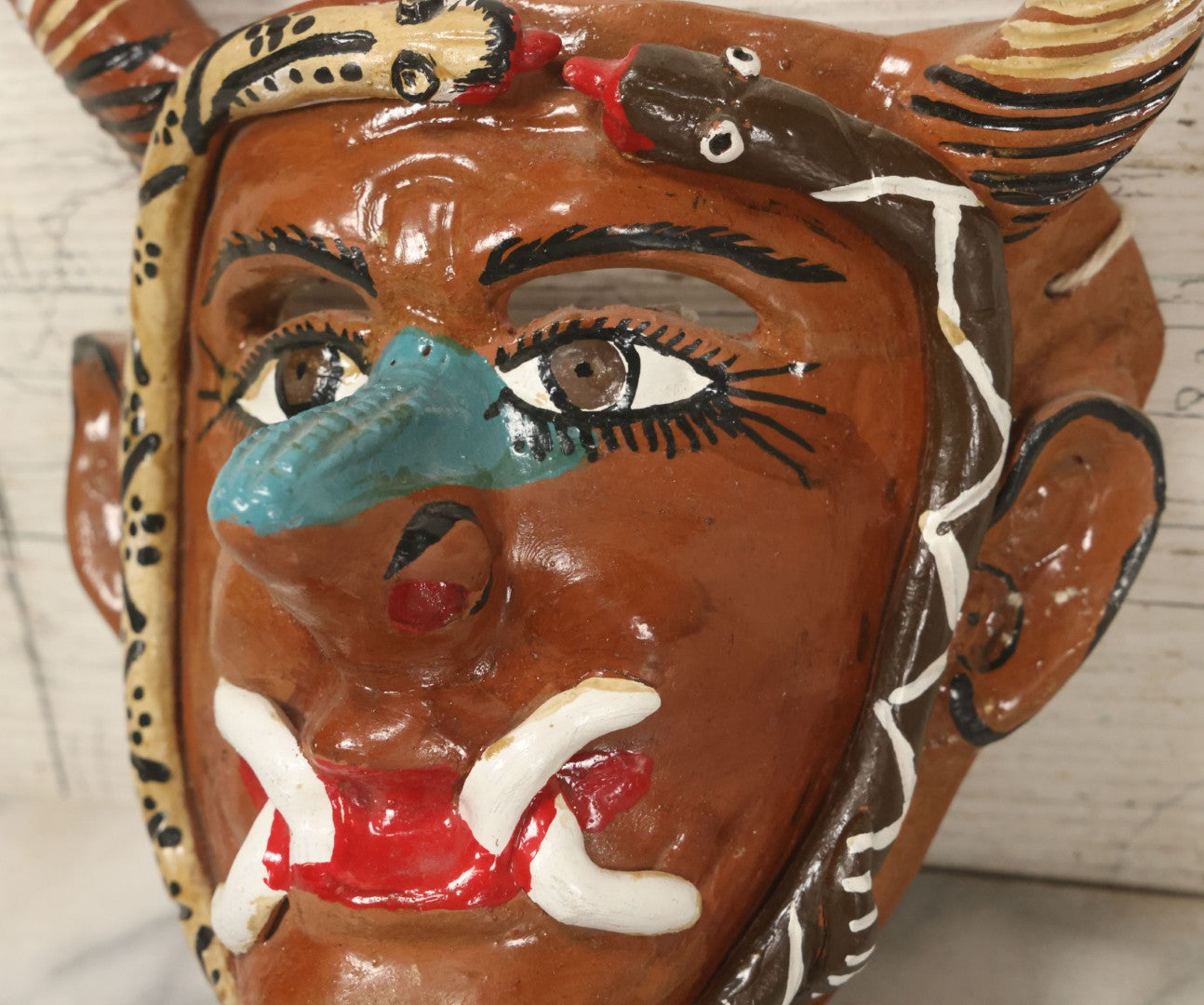 Lot 014 - Vintage Clay Devil Demon Mask With Striped Black And Gold Horns, Snakes Surrounding Face, Fangs, And Blue Nose, Hand Sculpted, Hand Painted, With Rope Hanger