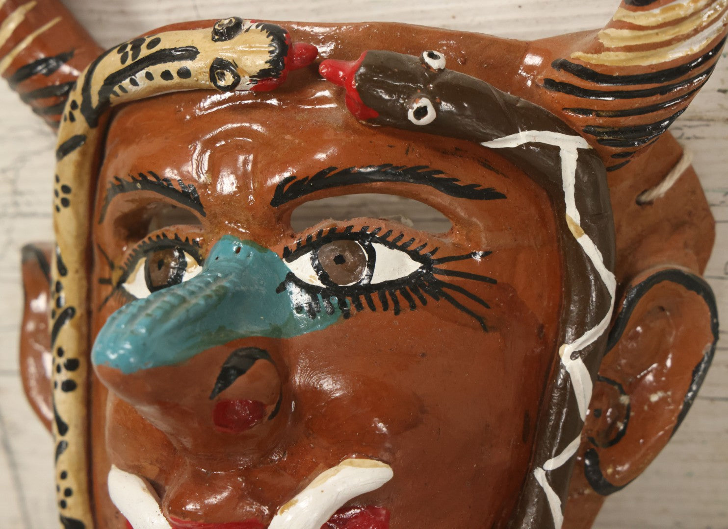 Lot 014 - Vintage Clay Devil Demon Mask With Striped Black And Gold Horns, Snakes Surrounding Face, Fangs, And Blue Nose, Hand Sculpted, Hand Painted, With Rope Hanger