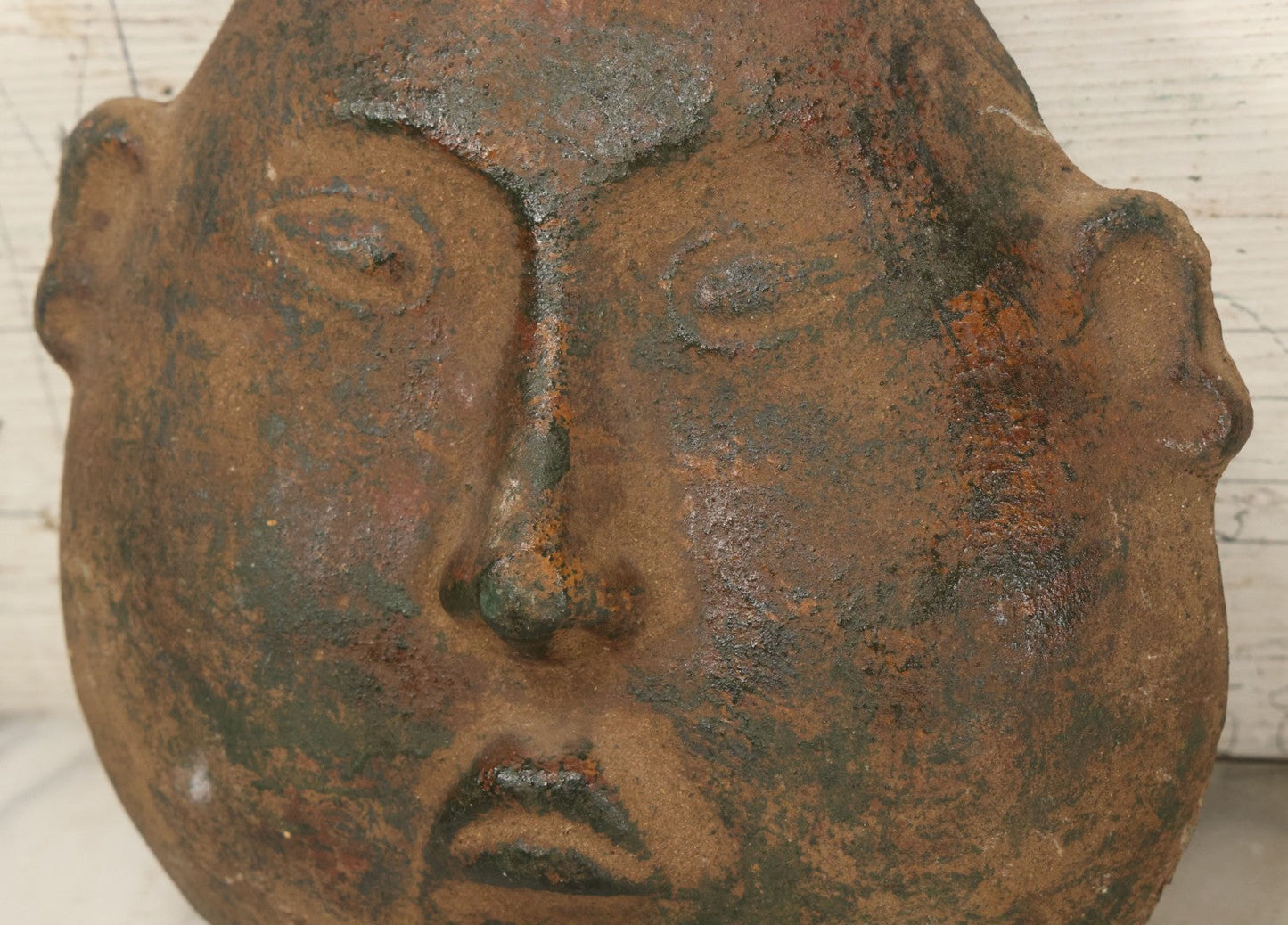 Lot 015 - Vintage Green Clay Eastern Mask With Rotund Face, Sad Expression, Faux-Patina Finish, With Wire Hanger