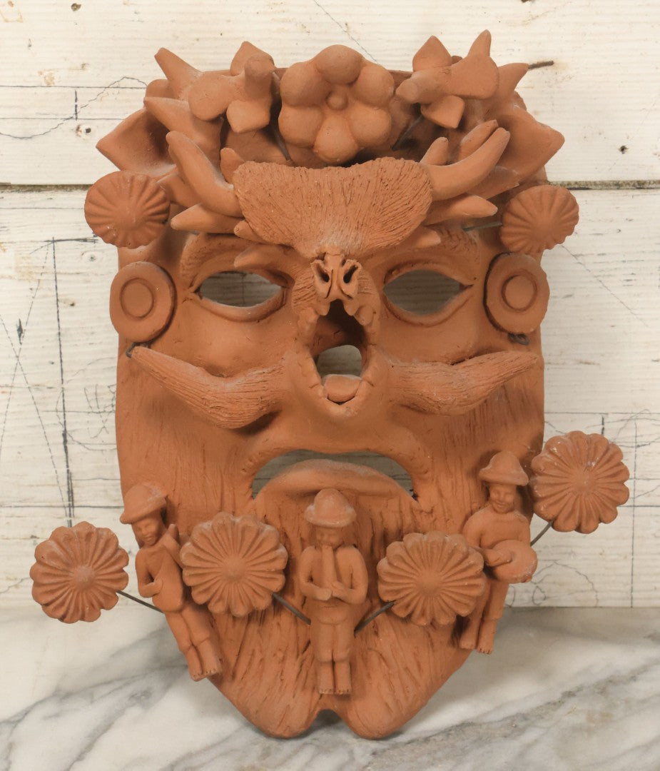 Lot 016 - Vintage Unpainted Red Clay Mexican Folk Art Mask, Made In Mexico Sticker On Verso, With Posable Wire Attached Adornments, With Wire Hanger