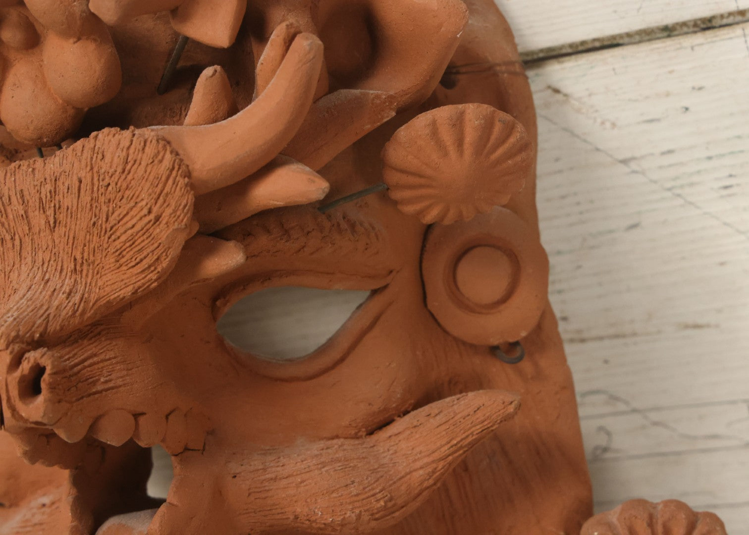 Lot 016 - Vintage Unpainted Red Clay Mexican Folk Art Mask, Made In Mexico Sticker On Verso, With Posable Wire Attached Adornments, With Wire Hanger