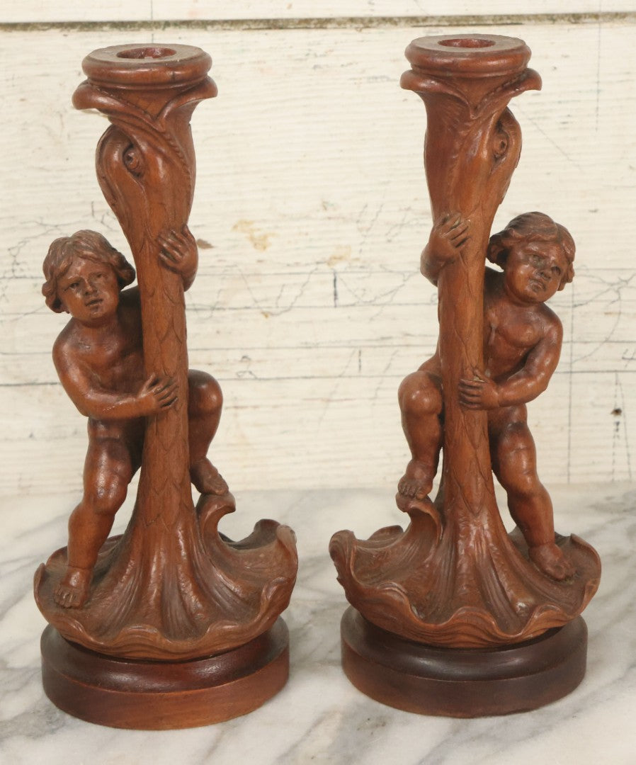 Lot 017 - Pair Of Antique Folk Art Carved Candlesticks With Cherub And Serpent Motif, 9-1/2" Height