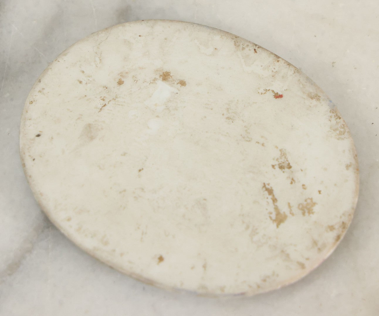 Lot 019 - Antique Miniature Hand Painted Porcelain Cameo Tile With Child In Green Hat With Flowers Hallmarked On Verso, Unmounted, 2" x 2-3/8"