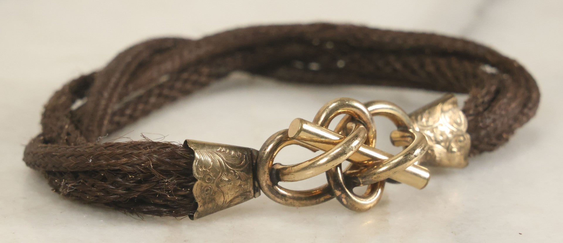Lot 020 - Antique Victorian Human Hair Work Cuff Bracelet With Brass Adornments, Opening Diameter Approximately 2-3/4"