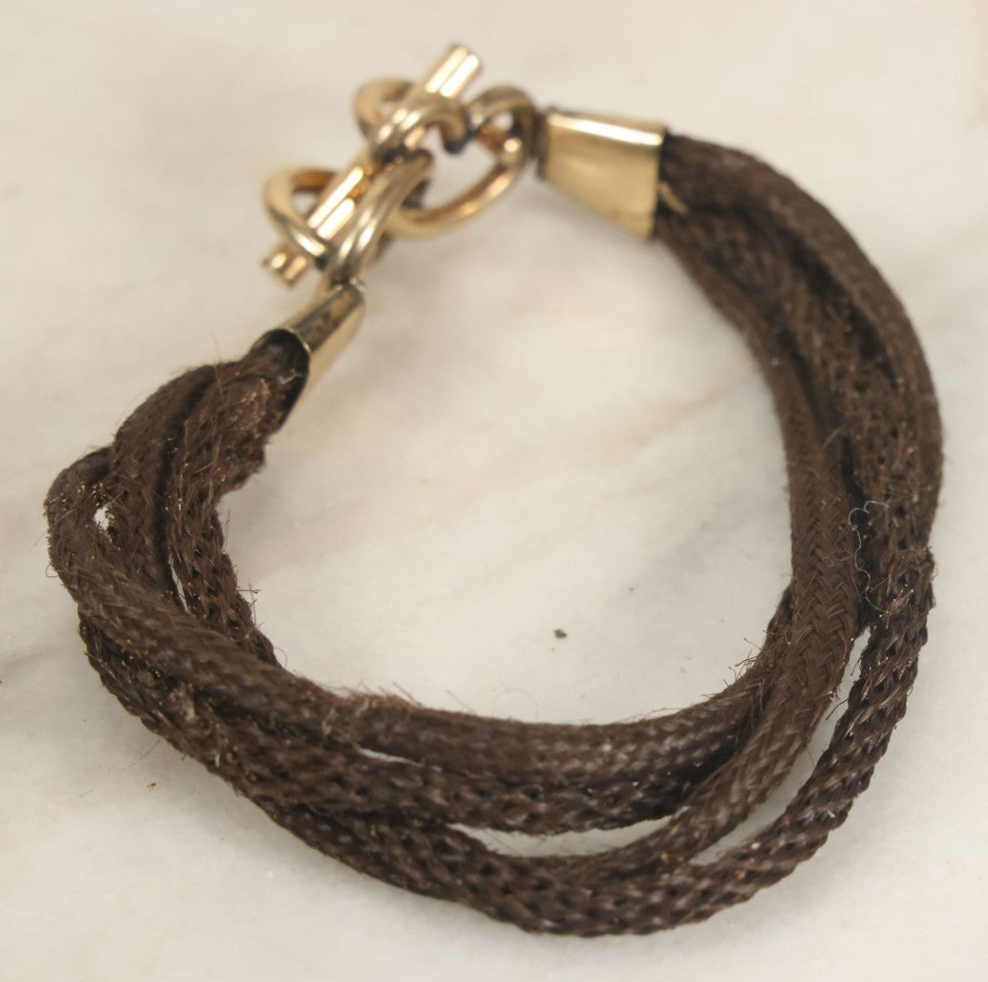 Lot 020 - Antique Victorian Human Hair Work Cuff Bracelet With Brass Adornments, Opening Diameter Approximately 2-3/4"