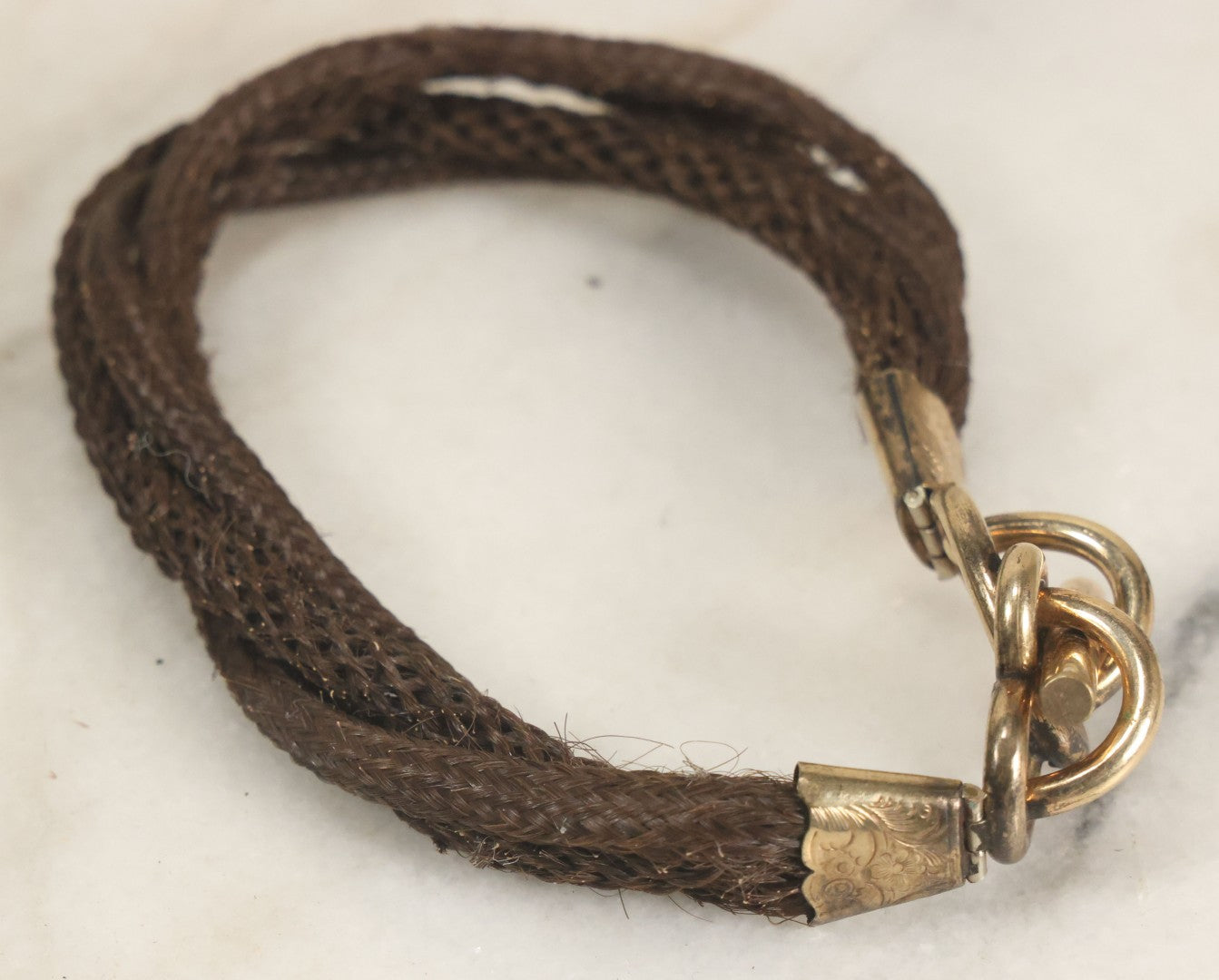 Lot 020 - Antique Victorian Human Hair Work Cuff Bracelet With Brass Adornments, Opening Diameter Approximately 2-3/4"