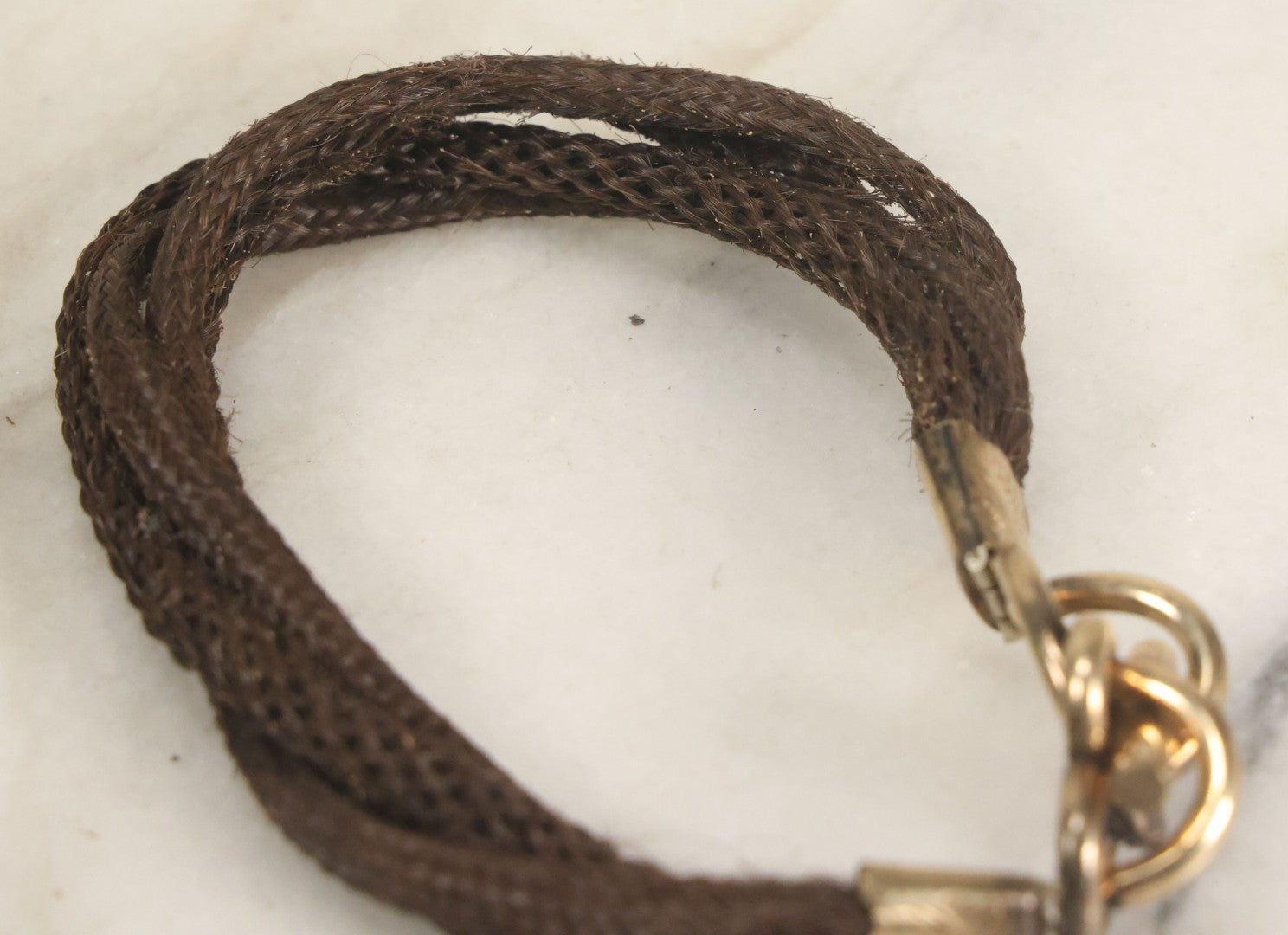 Lot 020 - Antique Victorian Human Hair Work Cuff Bracelet With Brass Adornments, Opening Diameter Approximately 2-3/4"