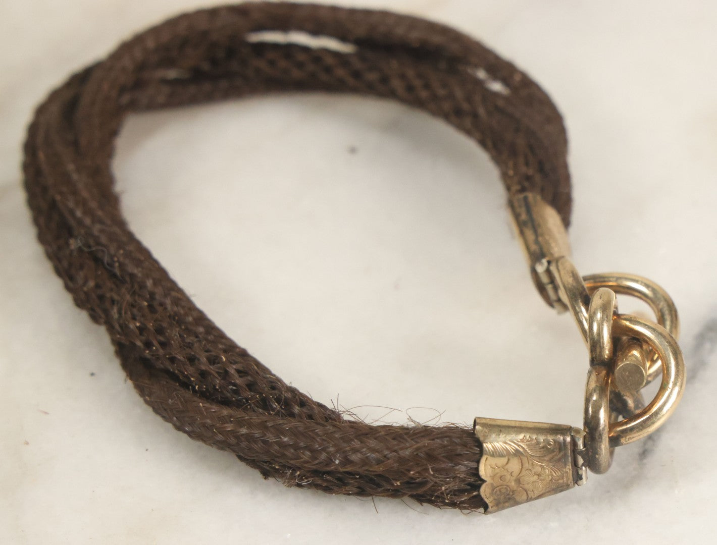Lot 020 - Antique Victorian Human Hair Work Cuff Bracelet With Brass Adornments, Opening Diameter Approximately 2-3/4"