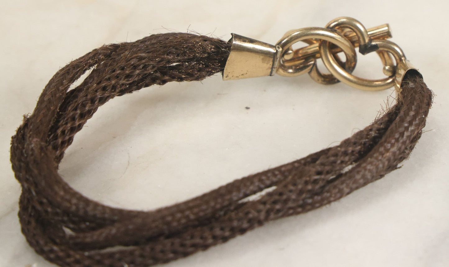 Lot 020 - Antique Victorian Human Hair Work Cuff Bracelet With Brass Adornments, Opening Diameter Approximately 2-3/4"