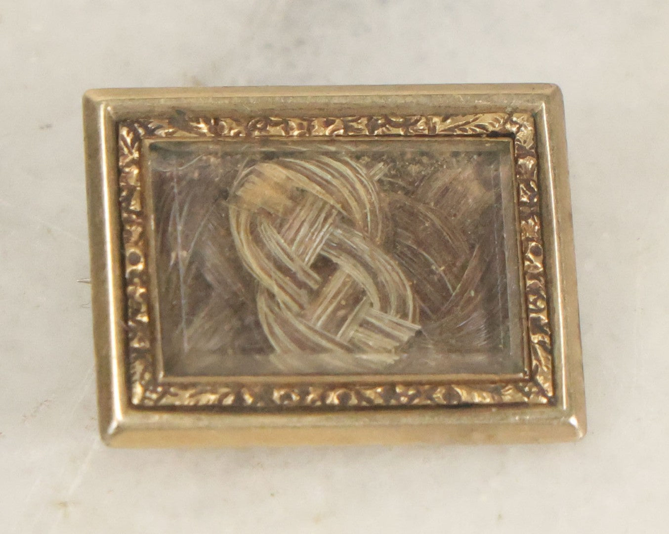 Lot 021 - Antique Victorian Human Hair Work Braided Brooch With Rectangular Beveled Glass Window And Pin Back, Blond And Brown Hair, Approximately 3/4" x 9/16"