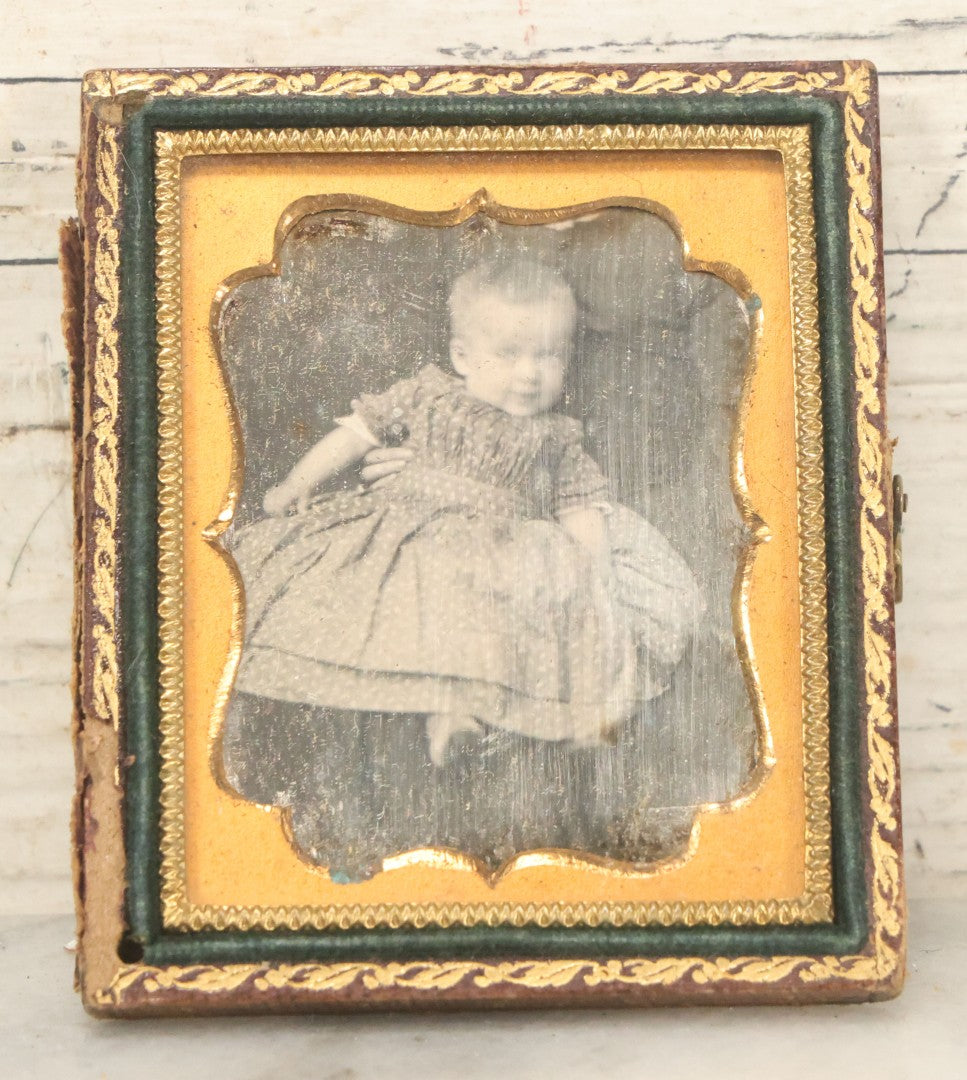 Lot 025 - Antique 1/9th Plate Daguerreotype Photograph Of Baby Held By "Not-So-Hidden" Mother, Note Hand On Baby's Waist, In Half Leatherette Union Case