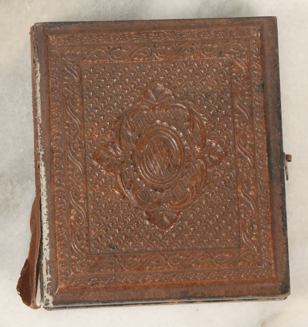 Lot 027 - Antique 1/6th Plate Ambrotype Photograph Of Young Mother Holding Newborn Baby, Wearing Tinted Jewelry, In Full Leatherette Union Case, Note Spine Repaired With Tape