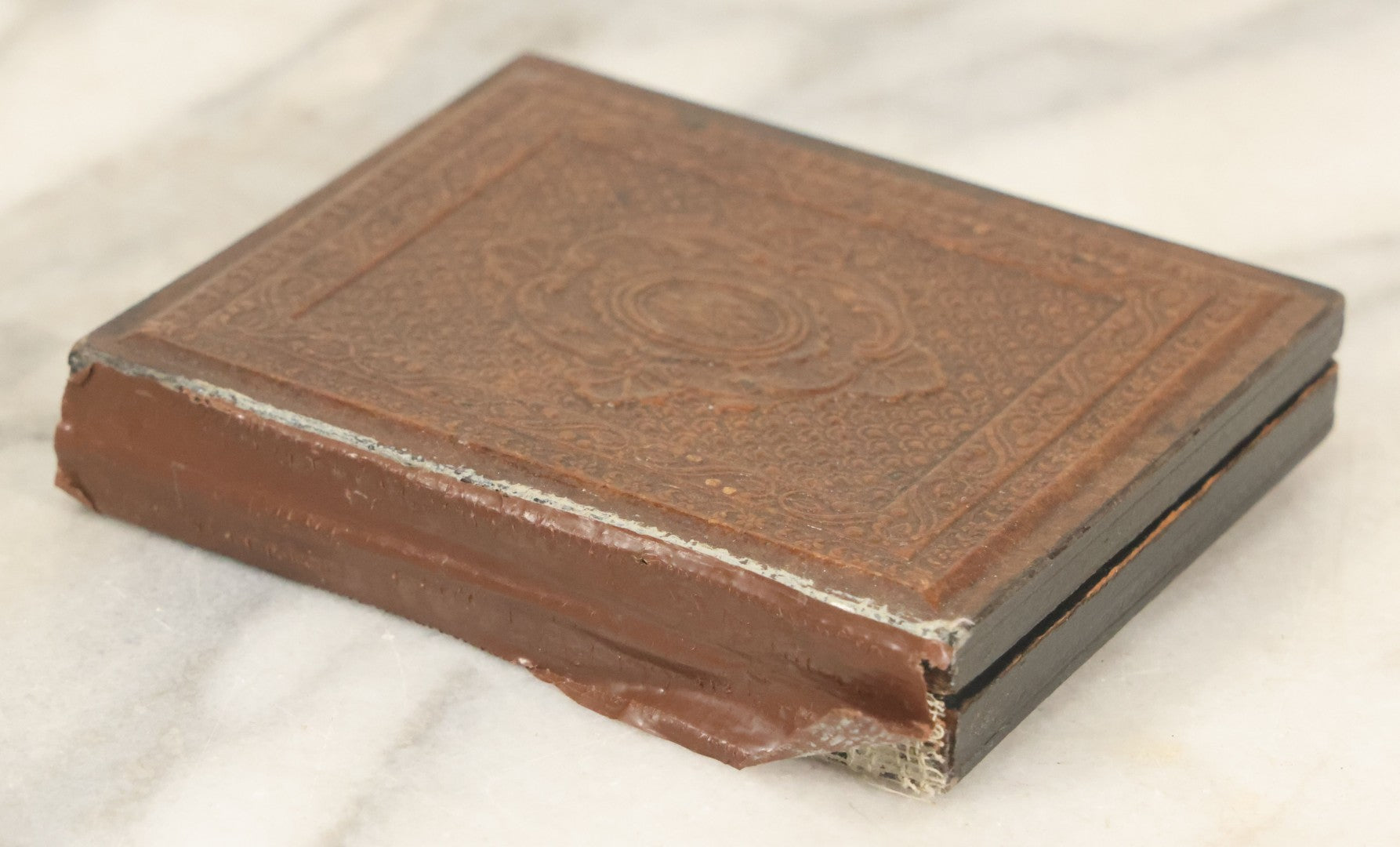 Lot 027 - Antique 1/6th Plate Ambrotype Photograph Of Young Mother Holding Newborn Baby, Wearing Tinted Jewelry, In Full Leatherette Union Case, Note Spine Repaired With Tape