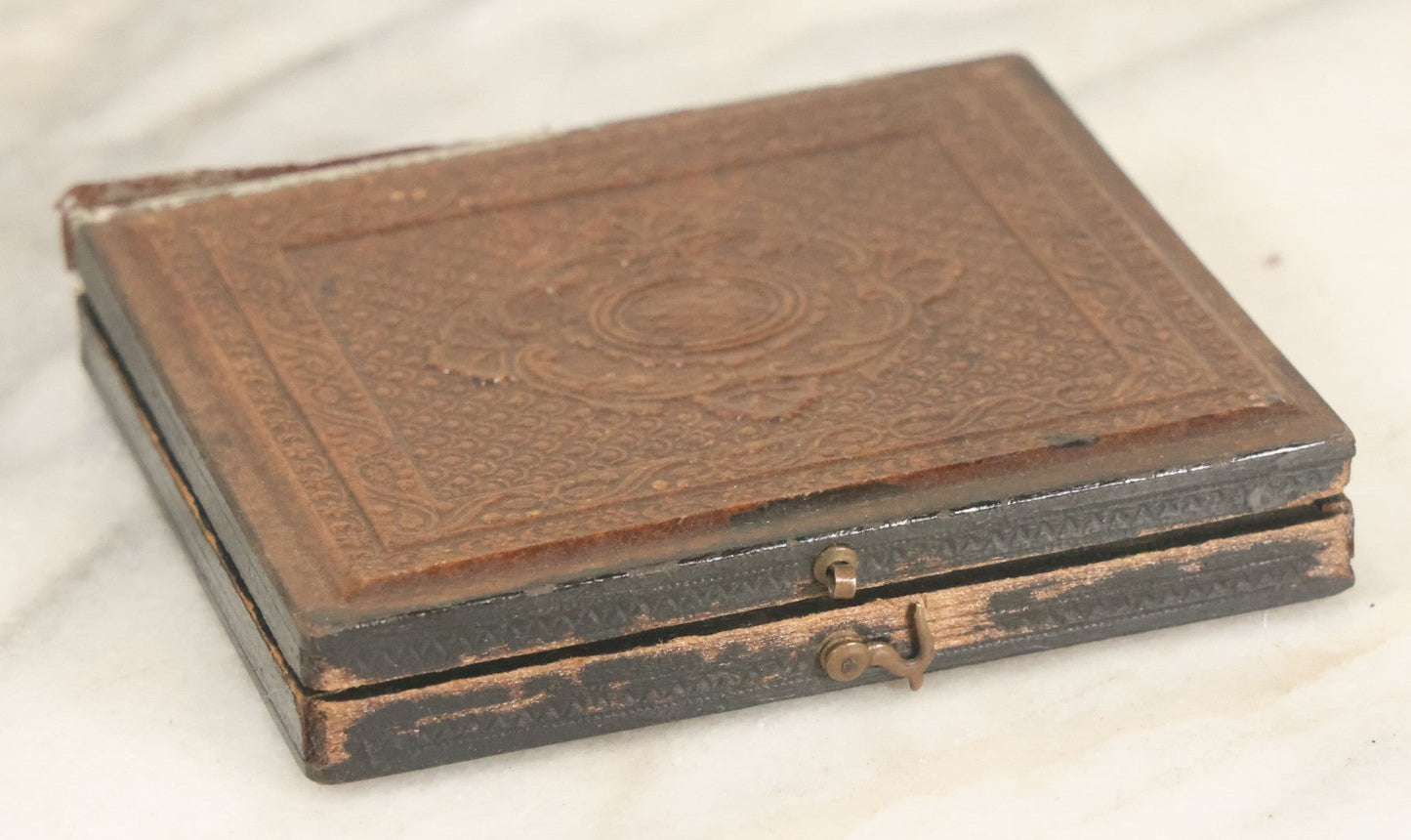 Lot 027 - Antique 1/6th Plate Ambrotype Photograph Of Young Mother Holding Newborn Baby, Wearing Tinted Jewelry, In Full Leatherette Union Case, Note Spine Repaired With Tape