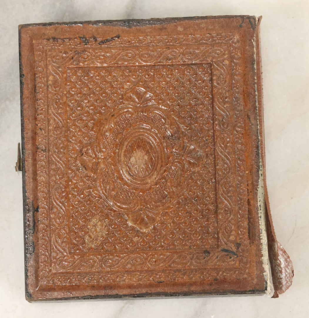 Lot 027 - Antique 1/6th Plate Ambrotype Photograph Of Young Mother Holding Newborn Baby, Wearing Tinted Jewelry, In Full Leatherette Union Case, Note Spine Repaired With Tape