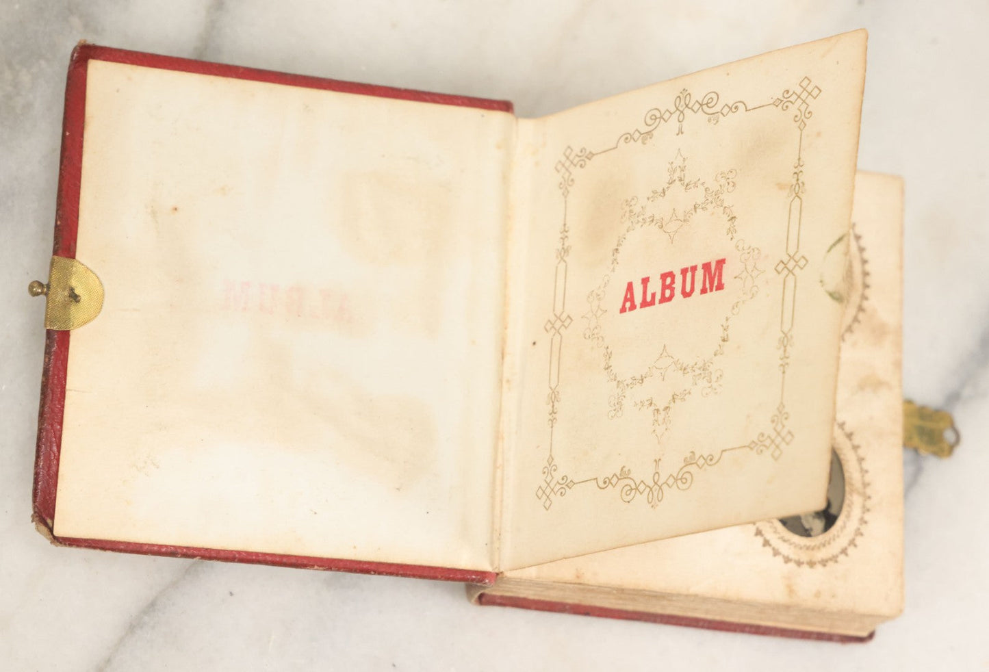 Lot 028 - Antique Red Covered Gem Tintype Photo Album, With 64 Gem Tintype Photographs Including Man In Fur Hat, Man In Top Hat, And Many Women And Children (All Pages Pictured)