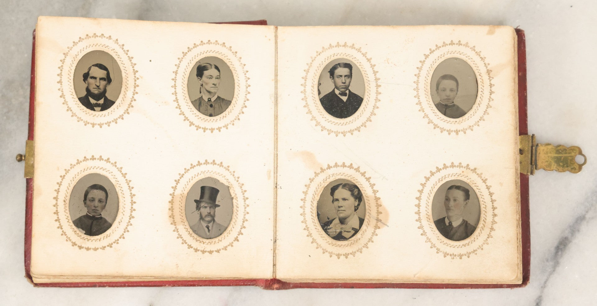 Lot 028 - Antique Red Covered Gem Tintype Photo Album, With 64 Gem Tintype Photographs Including Man In Fur Hat, Man In Top Hat, And Many Women And Children (All Pages Pictured)
