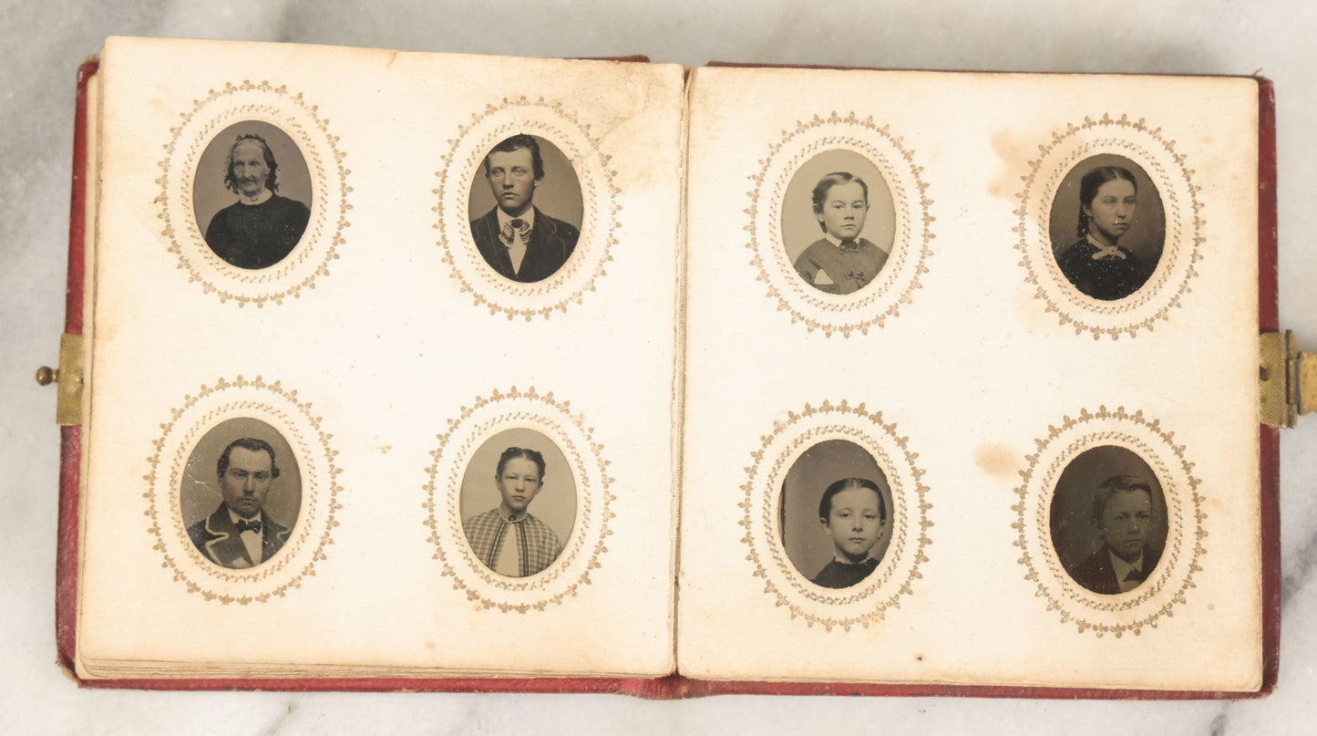 Lot 028 - Antique Red Covered Gem Tintype Photo Album, With 64 Gem Tintype Photographs Including Man In Fur Hat, Man In Top Hat, And Many Women And Children (All Pages Pictured)