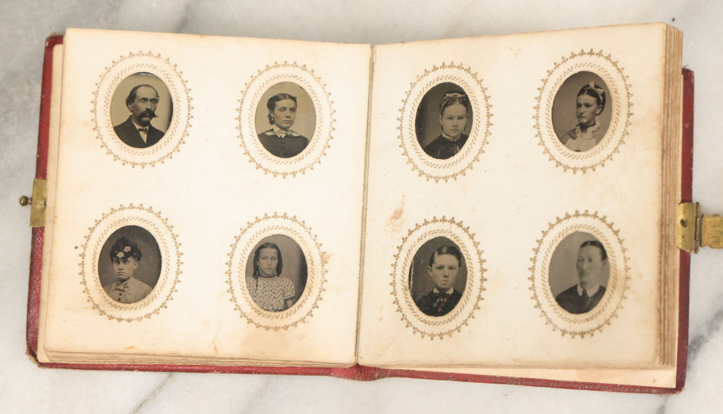 Lot 028 - Antique Red Covered Gem Tintype Photo Album, With 64 Gem Tintype Photographs Including Man In Fur Hat, Man In Top Hat, And Many Women And Children (All Pages Pictured)