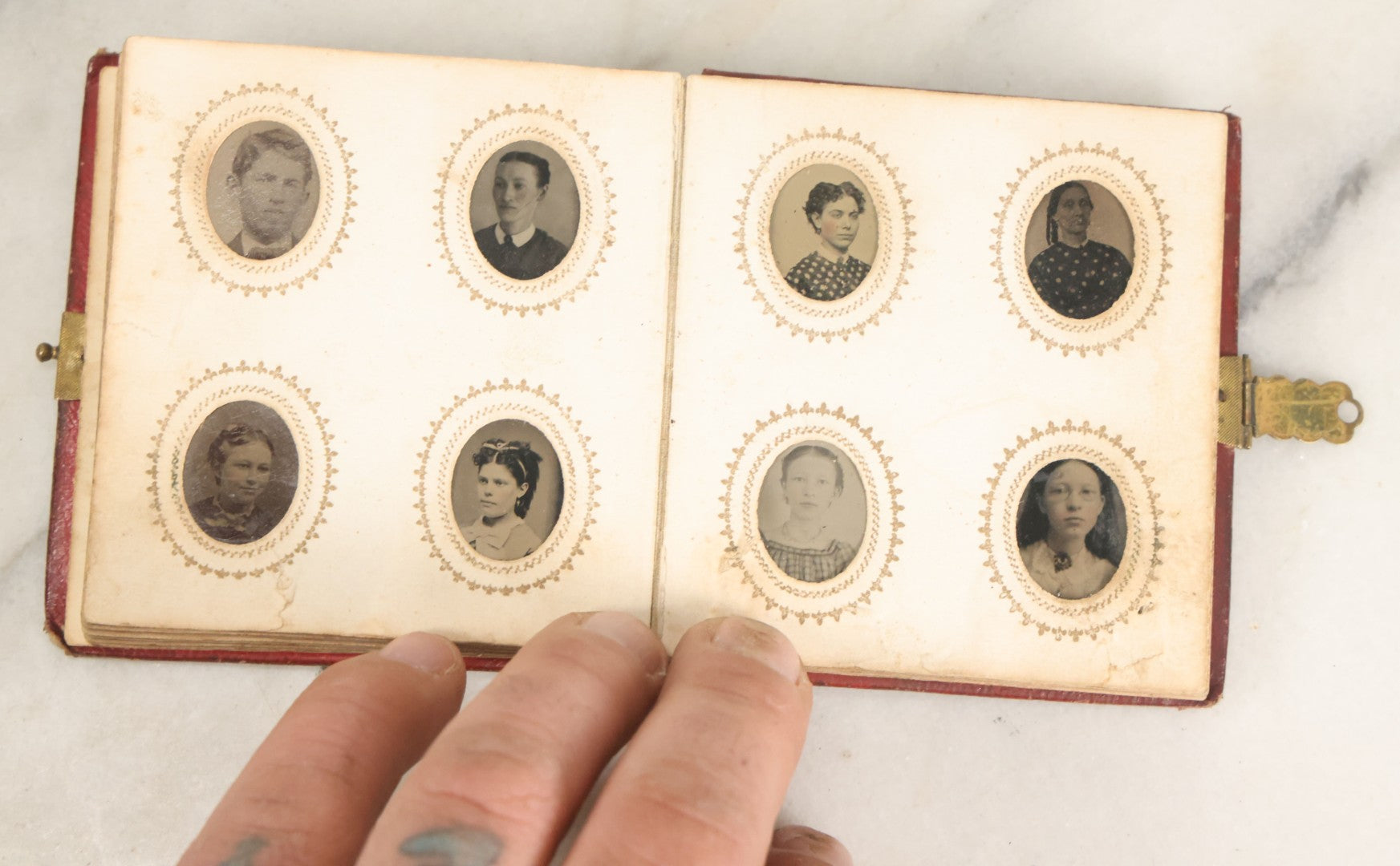 Lot 028 - Antique Red Covered Gem Tintype Photo Album, With 64 Gem Tintype Photographs Including Man In Fur Hat, Man In Top Hat, And Many Women And Children (All Pages Pictured)