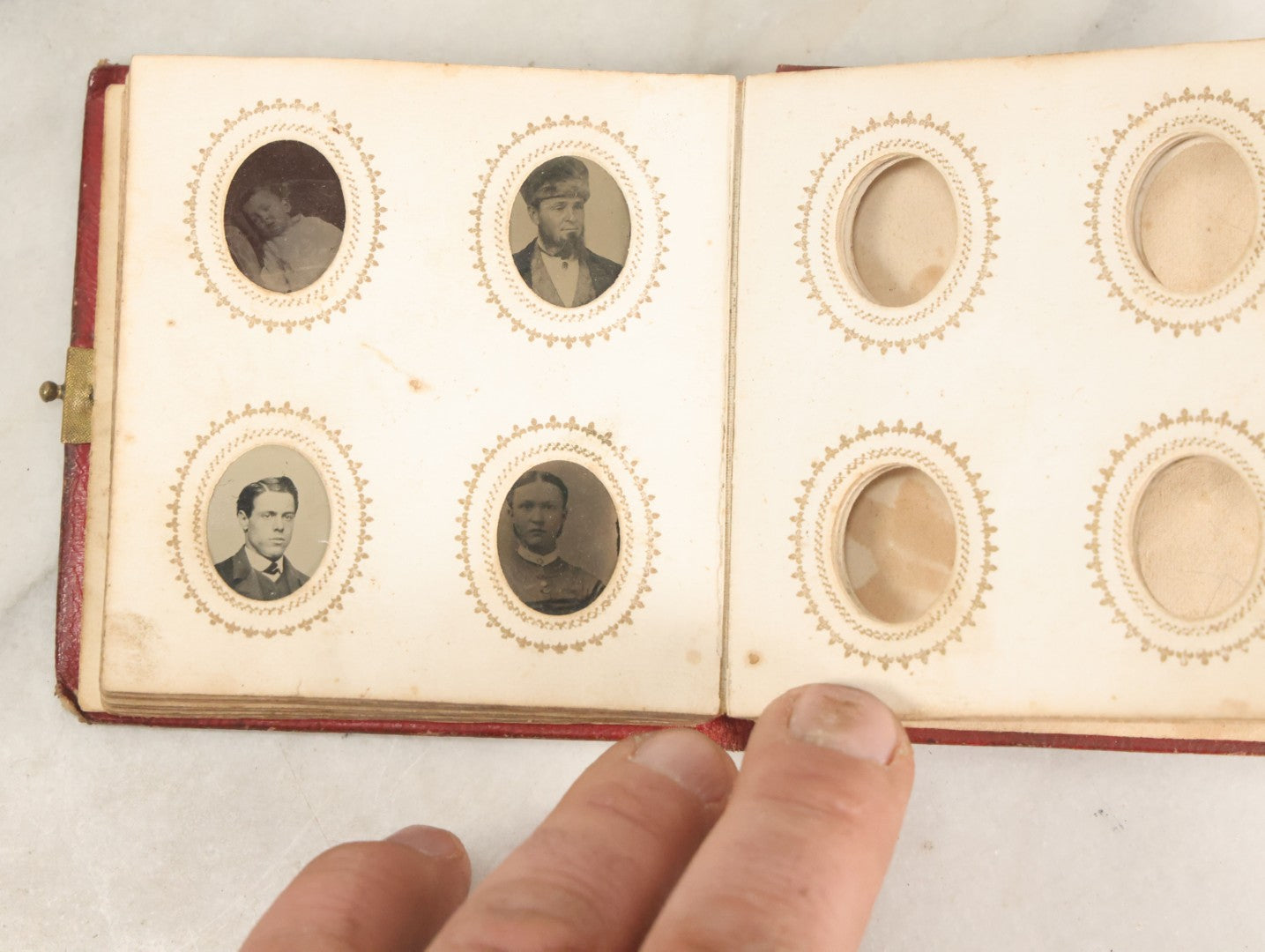 Lot 028 - Antique Red Covered Gem Tintype Photo Album, With 64 Gem Tintype Photographs Including Man In Fur Hat, Man In Top Hat, And Many Women And Children (All Pages Pictured)