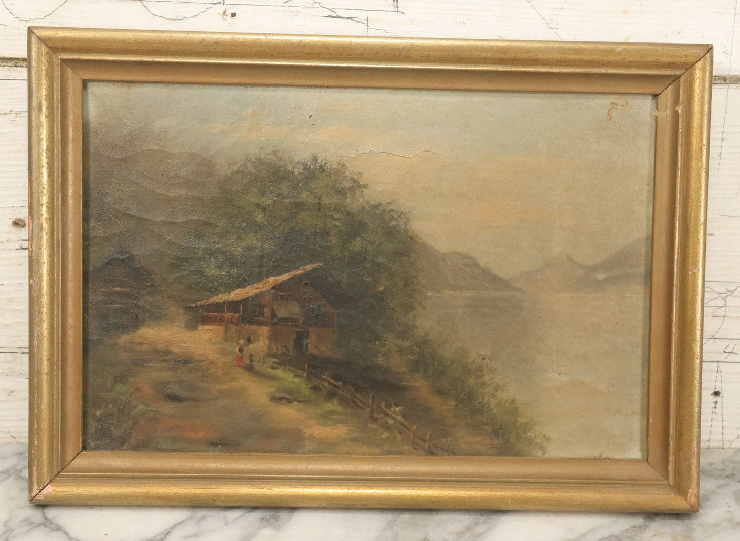 Lot 032 - Antique Oil On Canvas Country Landscape Painting Of Cabin By Lakeside With Mountains In Distance, Mother And Child In Scene, Unsigned, Note Holes And Losses, In Frame, 13-3/4" x 9-5/8"