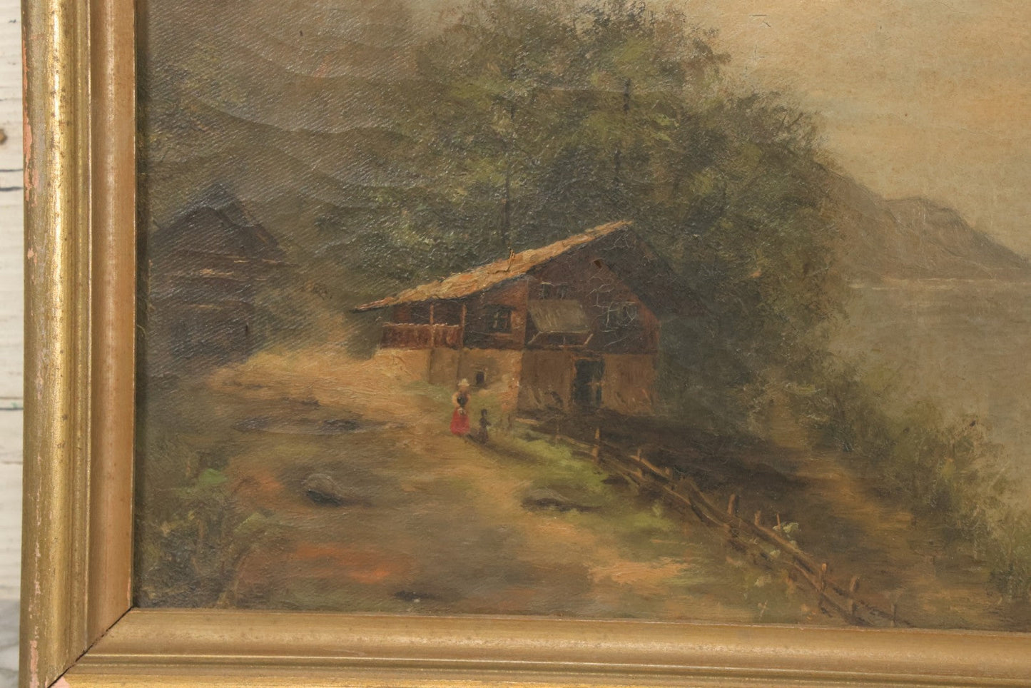 Lot 032 - Antique Oil On Canvas Country Landscape Painting Of Cabin By Lakeside With Mountains In Distance, Mother And Child In Scene, Unsigned, Note Holes And Losses, In Frame, 13-3/4" x 9-5/8"