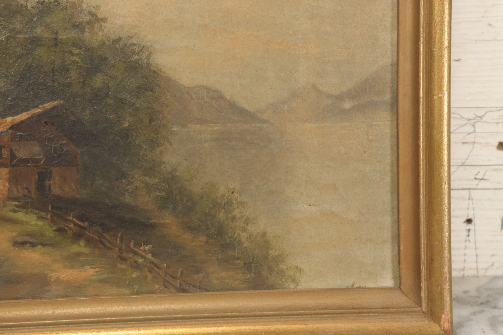 Lot 032 - Antique Oil On Canvas Country Landscape Painting Of Cabin By Lakeside With Mountains In Distance, Mother And Child In Scene, Unsigned, Note Holes And Losses, In Frame, 13-3/4" x 9-5/8"