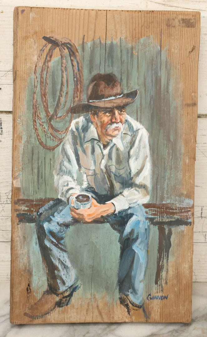 Lot 033 - Vintage Painting On Wood Panel Of Cowboy Drinking Coffee, Artist Signed Gannon, 8" x 13-1/2"
