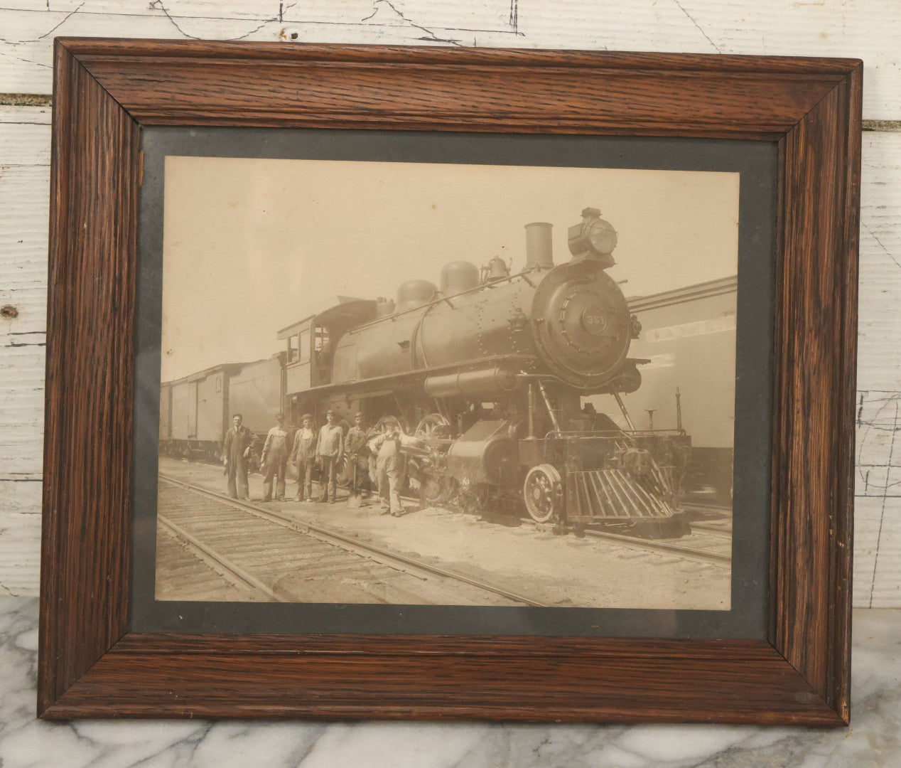 Lot 038 - Antique Boarded Occupational Photograph Of Locomotive 351 By American Locomotive Company, Maine Central Railroad, With Railroad Workers In Photo, Circa 1909 Partial Id On Verso, In Frame, Note Wear, 12-3/8" x 10-3/8"