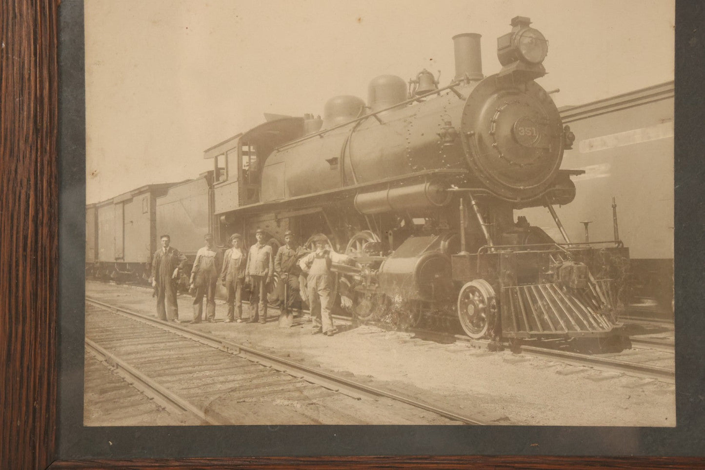 Lot 038 - Antique Boarded Occupational Photograph Of Locomotive 351 By American Locomotive Company, Maine Central Railroad, With Railroad Workers In Photo, Circa 1909 Partial Id On Verso, In Frame, Note Wear, 12-3/8" x 10-3/8"