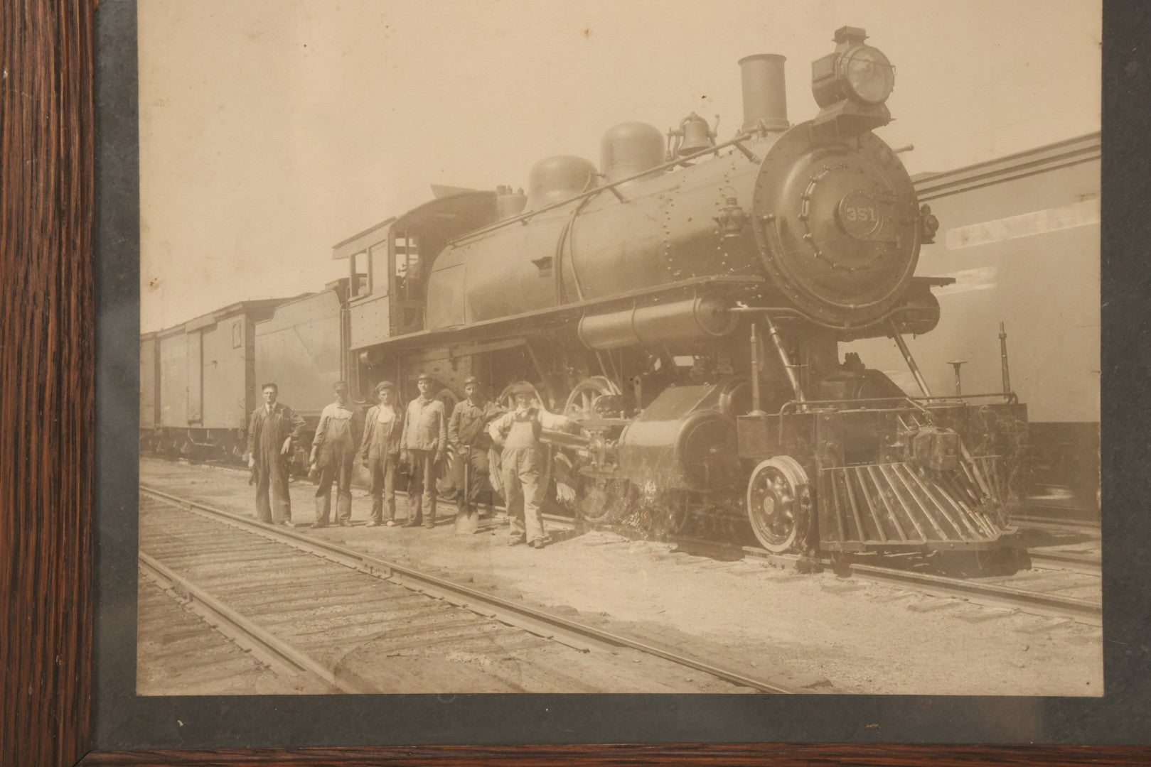 Lot 038 - Antique Boarded Occupational Photograph Of Locomotive 351 By American Locomotive Company, Maine Central Railroad, With Railroad Workers In Photo, Circa 1909 Partial Id On Verso, In Frame, Note Wear, 12-3/8" x 10-3/8"